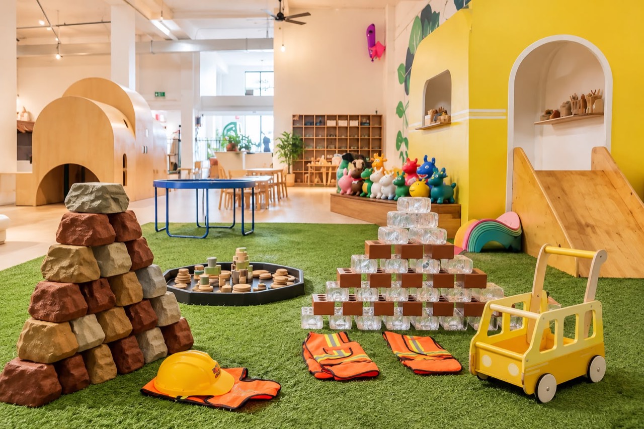 Imaginative construction play area with wooden cubbies at Play Nook