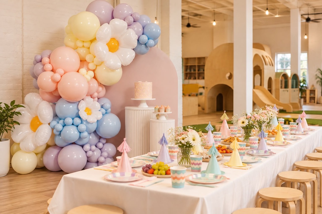 Pastel balloon display and birthday party tables at Play Nook